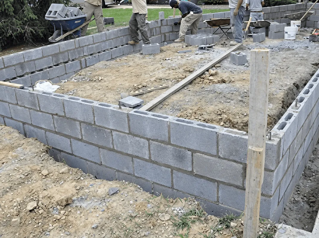 Professionals building a foundation with blocks in Oklahoma City, OK